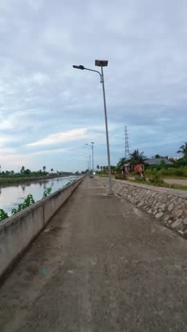 Concrete Canal Path with Solar Lights