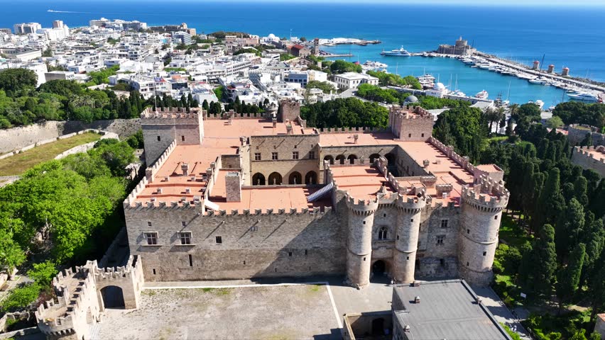Aerial drone cinematic video of iconic Palace of the Grand Master in old fortified town of Rhodes island an Unesco World Heritage site, Dodecanese, Greece