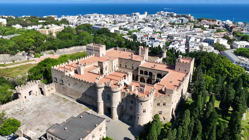 Aerial drone cinematic video of iconic Palace of the Grand Master in old fortified town of Rhodes island an Unesco World Heritage site, Dodecanese, Greece
