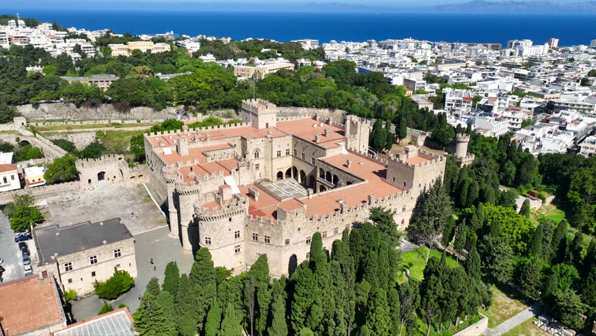 Aerial drone cinematic video of iconic Palace of the Grand Master in old fortified town of Rhodes island an Unesco World Heritage site, Dodecanese, Greece