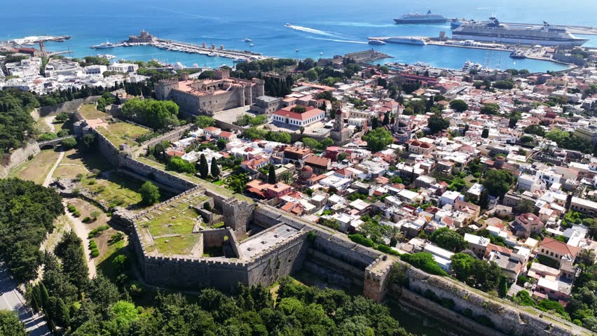 Aerial drone cinematic video of popular for tourists Medieval fortified old town of Rhodes island featuring nice restaurants and ancient sites an Unesco World Heritage, Dodecanese, Greece