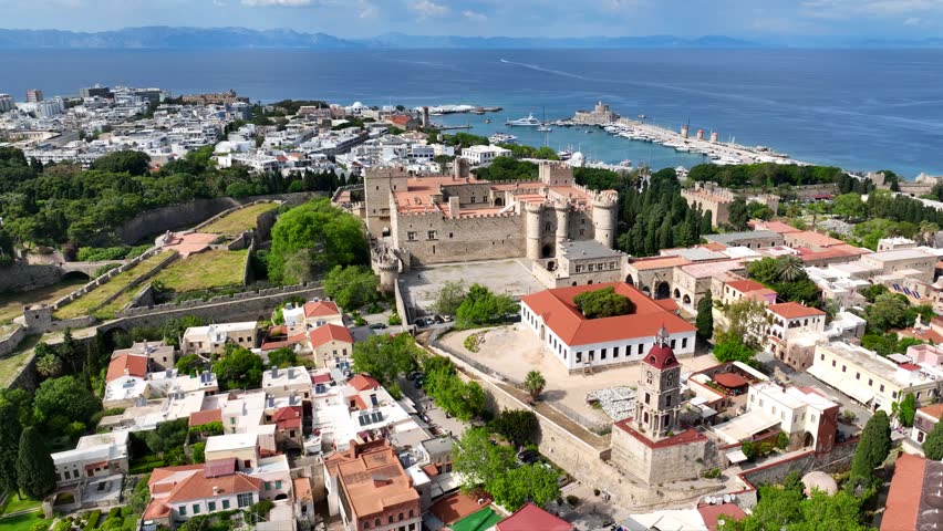 Aerial drone cinematic video of iconic Palace of the Grand Master in old fortified town of Rhodes island an Unesco World Heritage site, Dodecanese, Greece