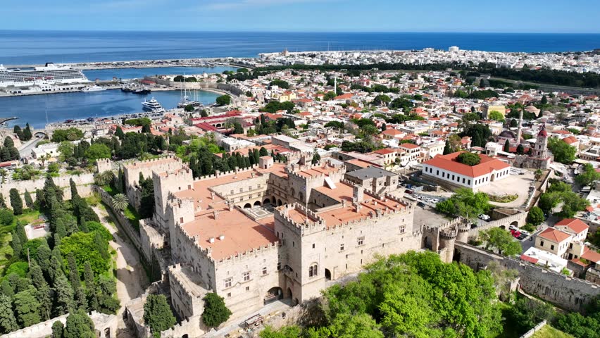 Aerial drone cinematic video of iconic Palace of the Grand Master in old fortified town of Rhodes island an Unesco World Heritage site, Dodecanese, Greece