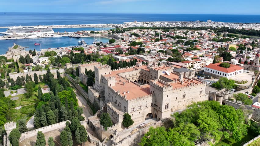 Aerial drone cinematic video of iconic Palace of the Grand Master in old fortified town of Rhodes island an Unesco World Heritage site, Dodecanese, Greece