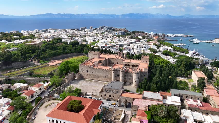 Aerial drone cinematic video of iconic Palace of the Grand Master in old fortified town of Rhodes island an Unesco World Heritage site, Dodecanese, Greece