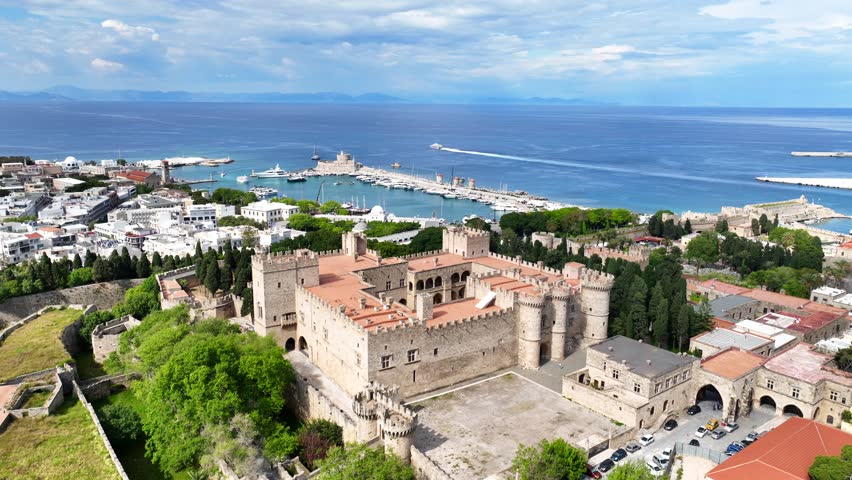 Aerial drone cinematic video of iconic Palace of the Grand Master in old fortified town of Rhodes island an Unesco World Heritage site, Dodecanese, Greece