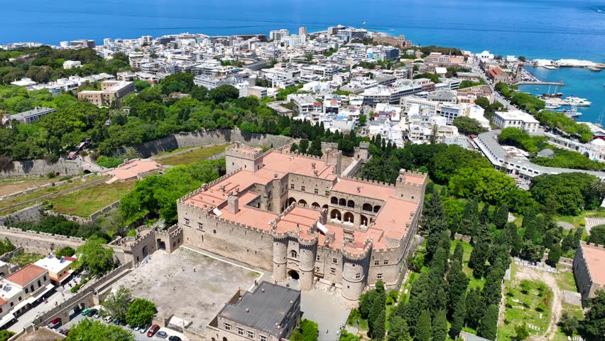 Aerial drone cinematic video of iconic Palace of the Grand Master in old fortified town of Rhodes island an Unesco World Heritage site, Dodecanese, Greece