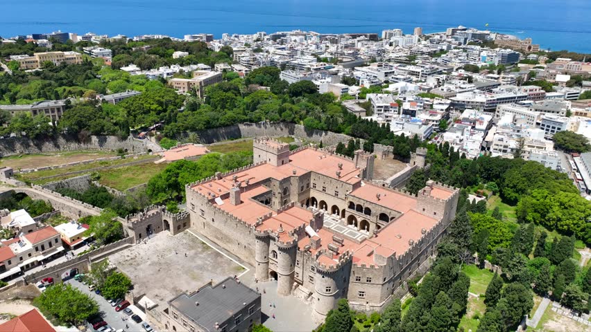 Aerial drone cinematic video of iconic Palace of the Grand Master in old fortified town of Rhodes island an Unesco World Heritage site, Dodecanese, Greece