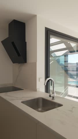 Vertical view of empty modern apartment with large glass windows