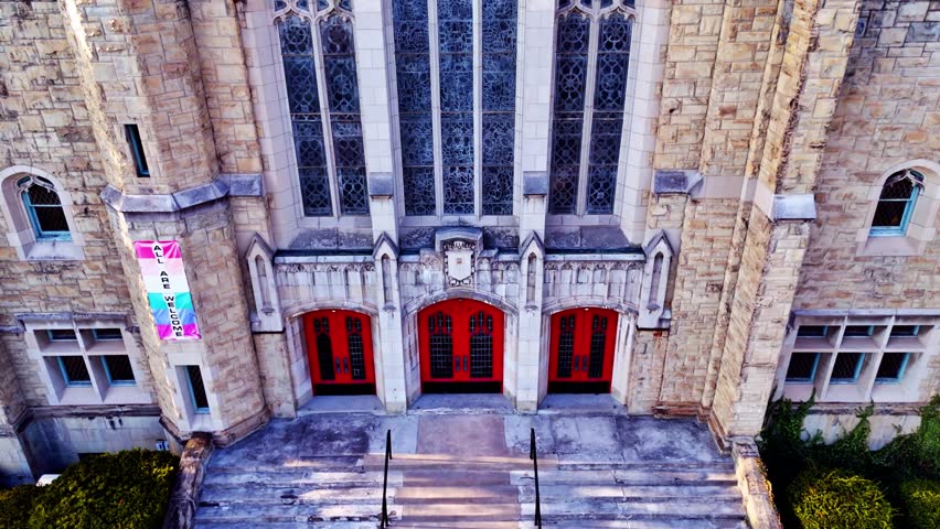 Methodically rising up and over the front face of a cathedral