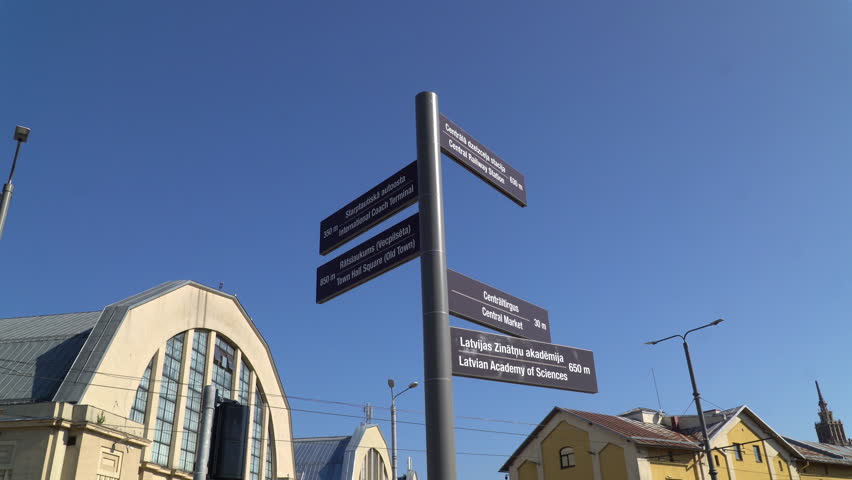 A street sign in Riga, Latvia, showcases directions to the important landmark of the city.