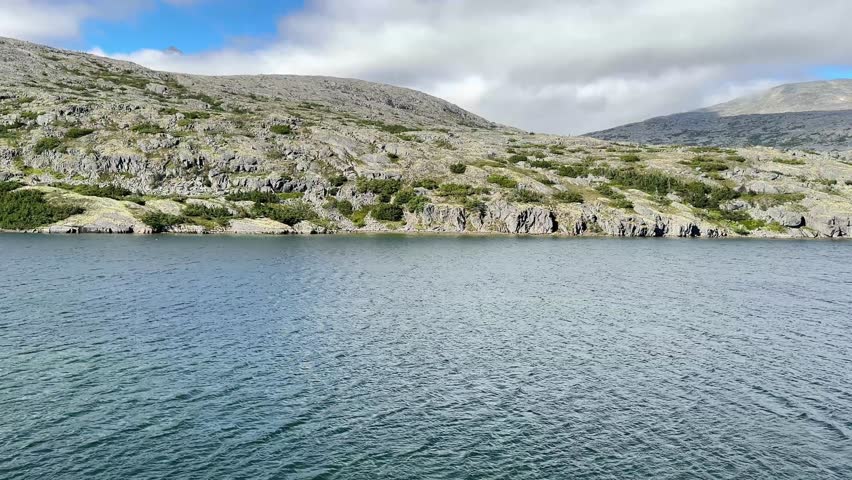 White Pass and  Yukon Railway, white rocky mountains and lakes, late August