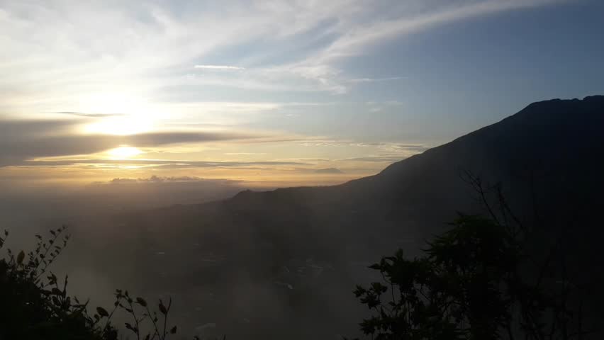 watching the sun rise over the mountains