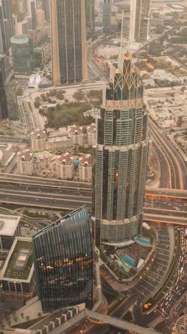 Dubai, UAE, United Arab Emirates. View Form Viewpoint on Burj Khalifa time lapse. Day to Night timelapse. Change Transition To Night. City Traffic Under Khalifa Tower.
