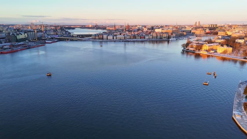 Amazing sunrise over the old town of Stockholm, with snow on the buildings, panoramic view