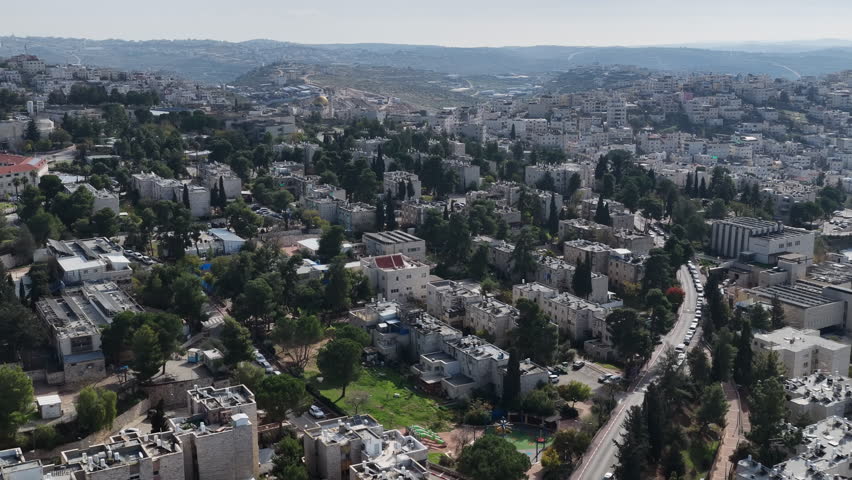 Aerial Urban Hillside Neighborhood Israel

Drone footage of dense residential buildings and green hills spread across an urban landscape, November 2025, Israel
