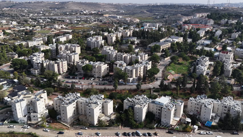Aerial Urban Hillside Neighborhood Israel

Drone footage of dense residential buildings and green hills spread across an urban landscape, November 2025, Israel
