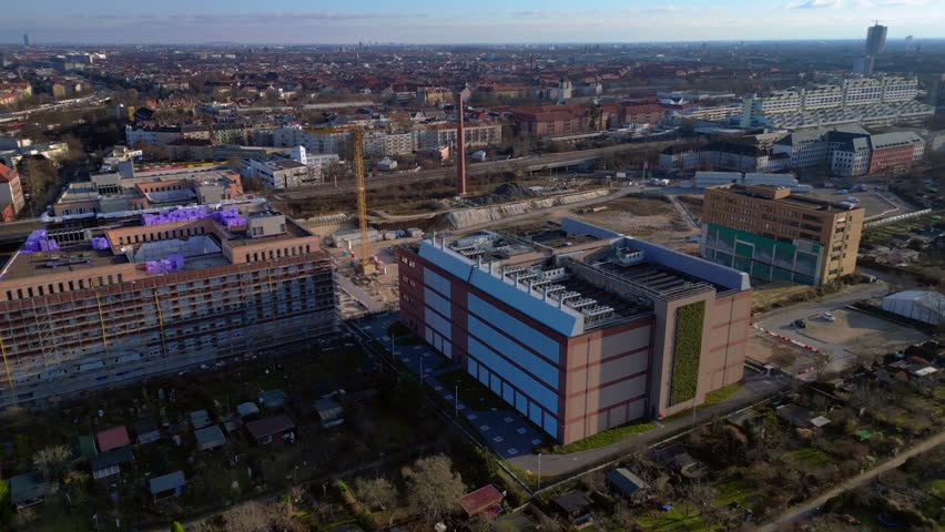 supercomputer in modern datacenter building in city. Perfect aerial view drone