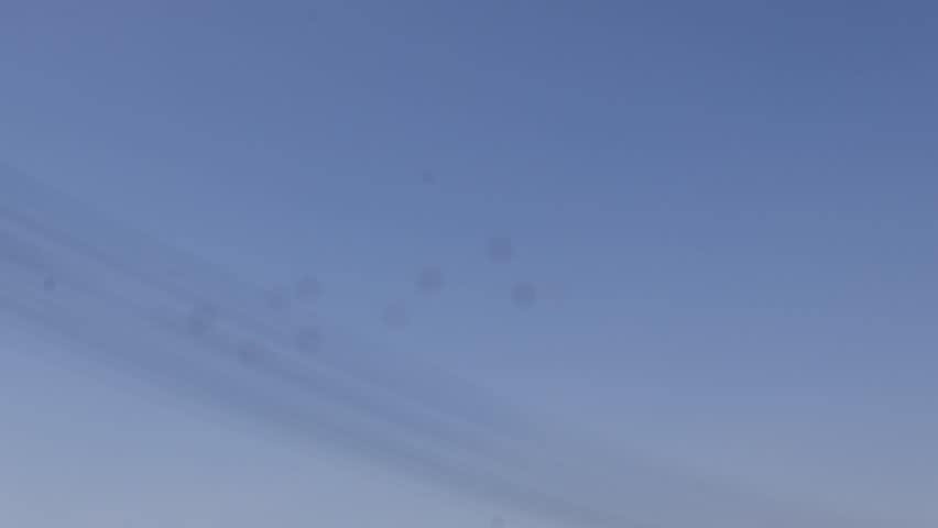 Scenic view of a temple under a clear blue sky, showcasing traditional architecture and peaceful surroundings.