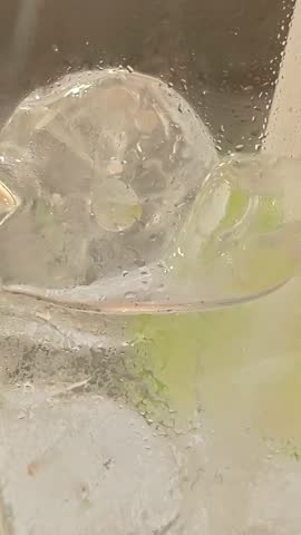 Pouring tonic soda water into ice cube glass Fizzy carbonated Drink Cocktail Refreshment Sparkling Water Beverage