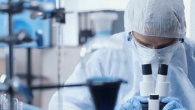 A scientist examines samples under a microscope while advanced 3D brain and DNA scans animate in a futuristic laboratory environment.
 - Powered by Shutterstock - Get 15% off with code: PIKWIZARD15