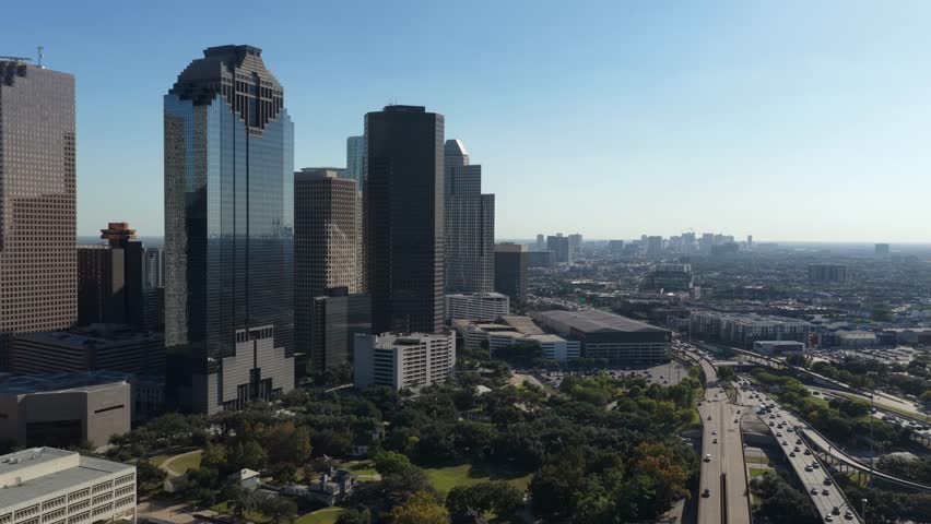Houston, Texas, United States – November 2025:
Wide aerial drone shot capturing Houston’s skyline with high-rise buildings, business districts, and green spaces visible below. The perspective emphasizes the scale of one of the largest cities in the United States.