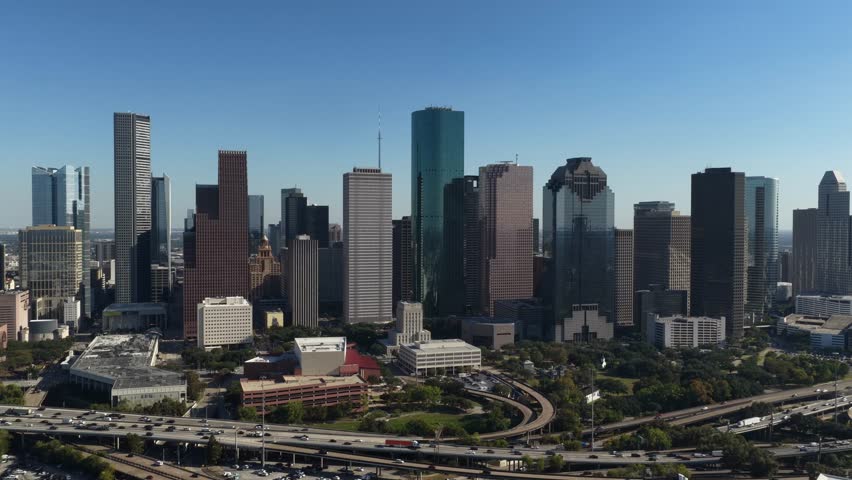 Houston, Texas, United States – November 2025:
Drone aerial perspective of Houston’s central business district showing modern towers, surrounding neighborhoods, and expansive city limits stretching into the distance under clear weather.