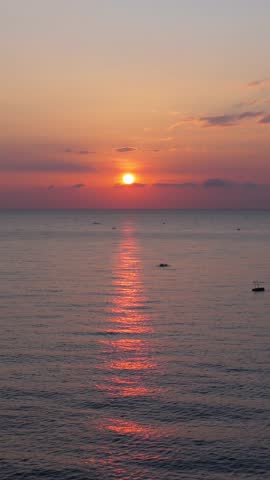 Beautiful sunset over calm ocean with reflection