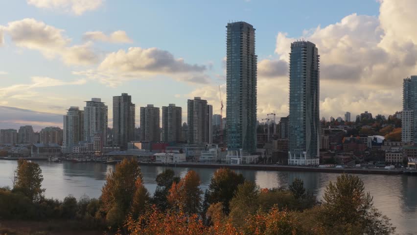 New Westminster City Skyline Along Fraser River in British Columbia, Canada at Sunset