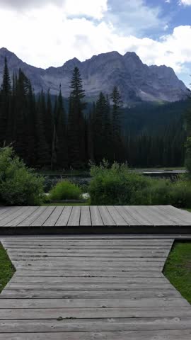 Scenic Mountain Lake View with Forest and Dock in British Columbia, Canada