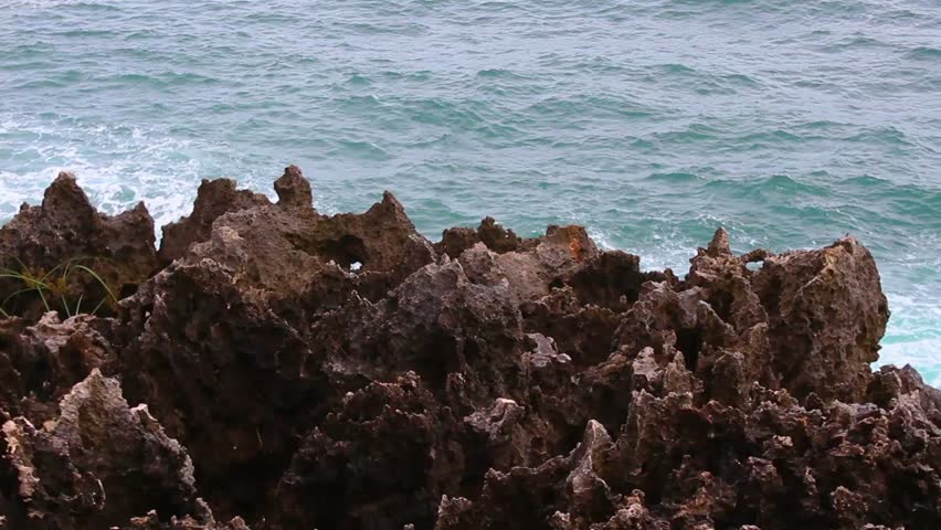 Rocky coastal cliff overlooking calm ocean