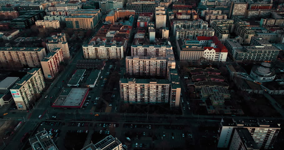 Aerial view of residential buildings in Budapest, Hungary. Footage shows rooftops, streets, urban layout, and surrounding cityscape from above, capturing the city’s architecture and density.