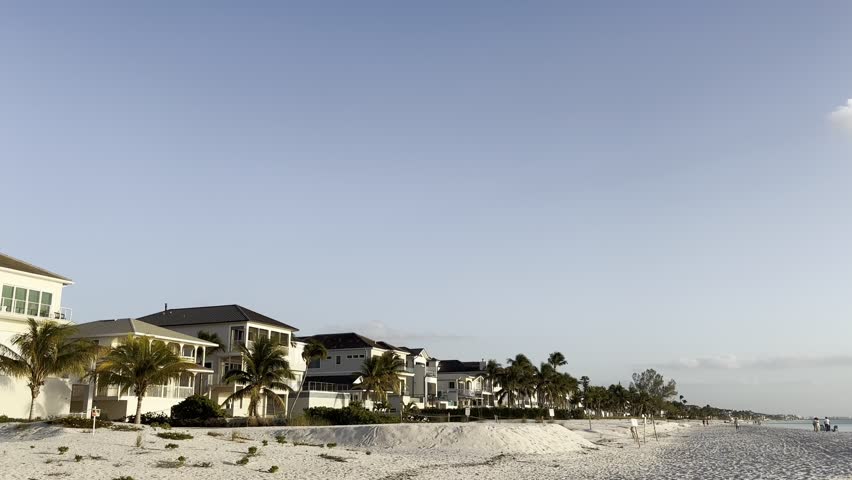 New construction and rebuilding efforts progressing on a residential street near Fort Myers Beach on Hickory Boulevard in Bonita Springs, Florida, symbolizing post-hurricane recovery