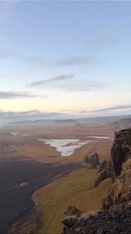 Long Coastal Beach at Sunset with Soft Sky