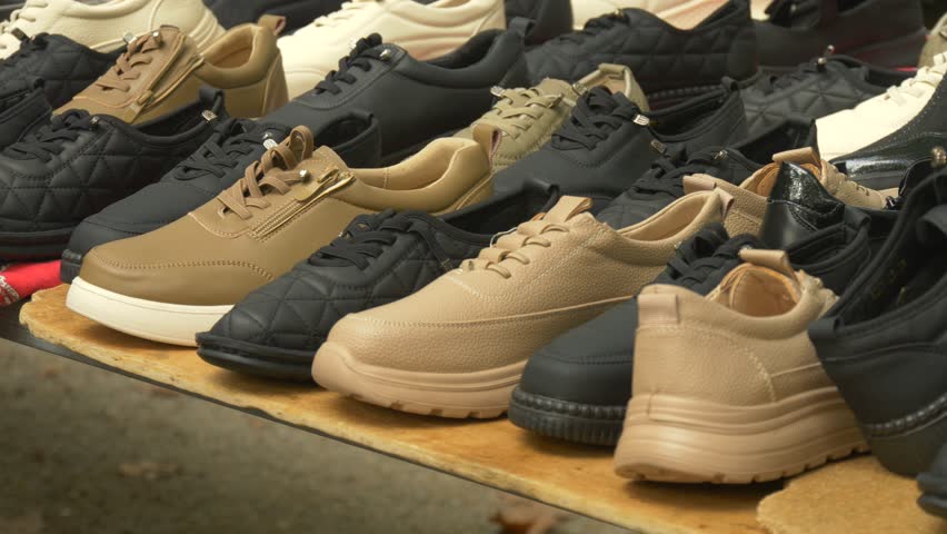 Assorted Casual Sneakers Displayed on Market Stall Representing Affordable Everyday Fashion Footwear