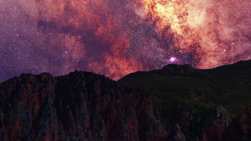 Rocks and mountains under milky way galaxy timelapse. Beautiful night sky landscape. 