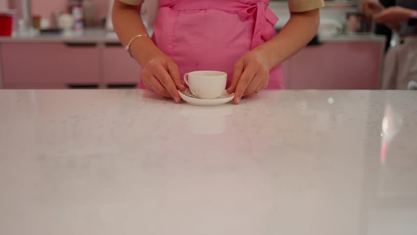 Barista serving coffee in cozy cafe. Coffee shop concept.