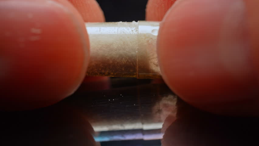 Display of Synthetic opioid drug of fentanyl in the capsule for distribution. Concept of Mental health youth overdose in Indigenous communities. Toxic drug opioid crisis and struggle with an addiction
