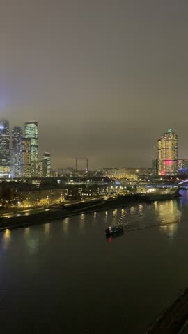 Moscow, Russia. December 30, 2025. Night panorama of the city. View of the Moscow River and the skyscrapers of the Moscow City.