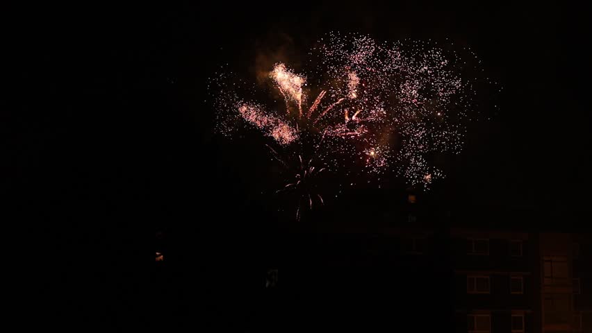 colorful festive fireworks for New Year celebrations on background of the night sky