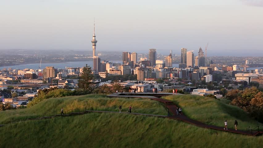 Sky Tower and skyline of Auckland city, New Zealand, viewed from Mt Eden at dusk