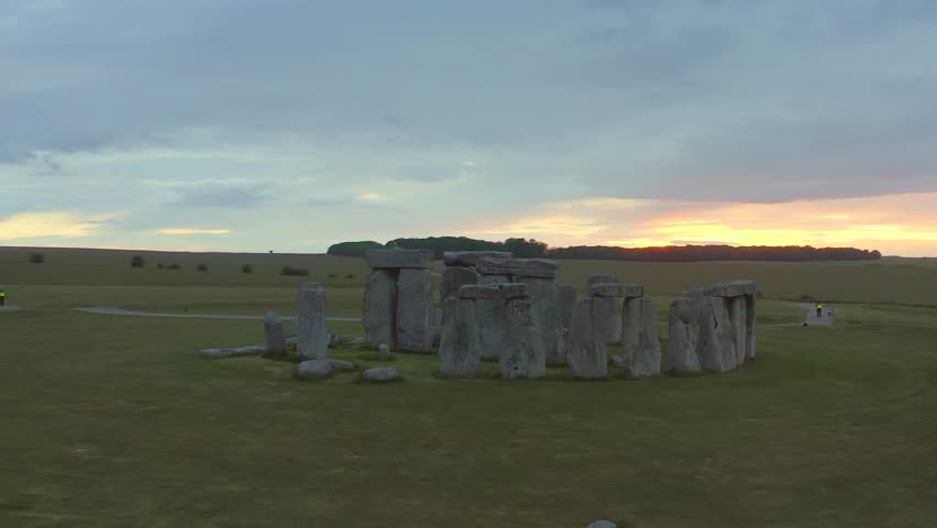 Stonehenge, England - sunset aerial tracking around stone circle