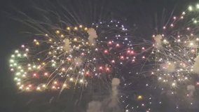 Fireworks are being set off to celebrate New Year's Day 2026. Happy New Year! Taken from my house. - Powered by Shutterstock - Get 15% off with code: PIKWIZARD15