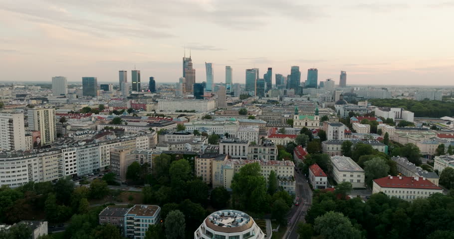 Aerial view of Warsaw cityscape with a distant Downtown Skyline. Typical urban panorama of Polish landmarks, ideal for establishing scenes and European capital city visuals. Cinematic 4K drone shot
