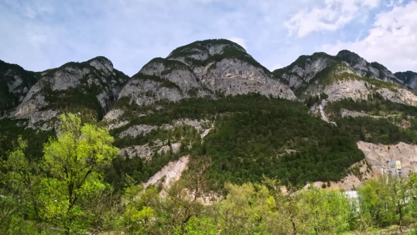 Scenic Rock Mountain Ridge View On A Train Traveling From Innsbruck And Munich. POV Shot