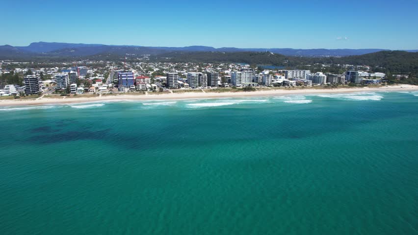 Beachfront Hotel Buildings In Palm Beach, QLD, Australia. - aerial shot