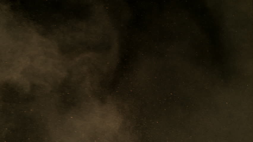 Freeze Motion Shot of Flying Sand Dust , Isolated on Black Background