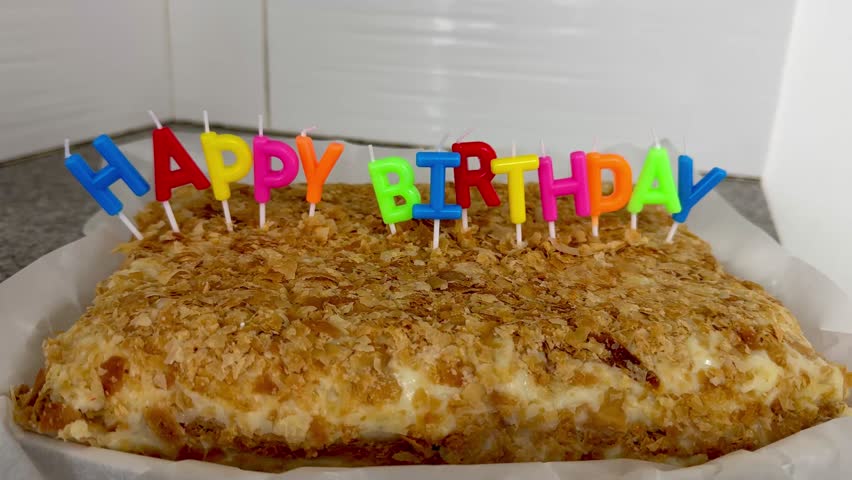 Birthday cake with colorful letter candles. Birthday celebration.