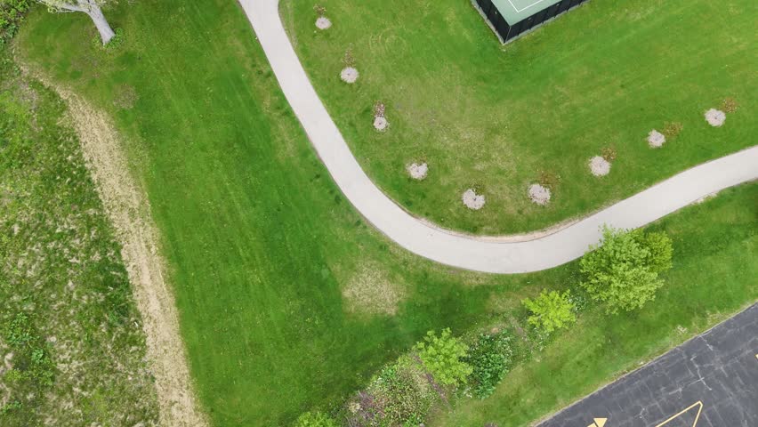 Aerial of Cedarburg Wisconsin USA on Spring Day.   Birds Eye shot showing Tennis, Pickleball Courts and Baseball Field.