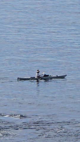 Footage of a man rowing a boat at Crescent Bay Beach at Crescent Bay Point Park in Laguna Beach California USA